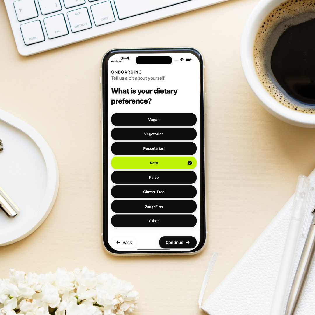 iPhone displaying personalized diet AI app with coffee table setup